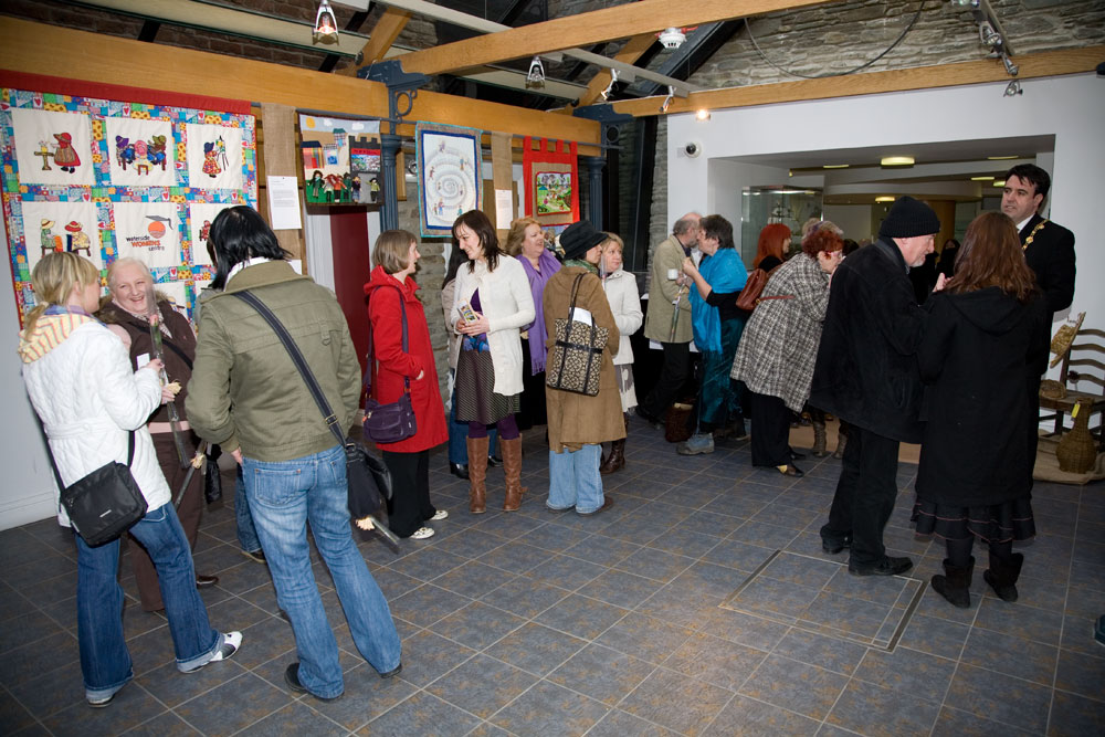 Attendees catching up and viewing the exhibits at the exhibition launch, 5th March, 2009. (Photo: Martin Melaugh)