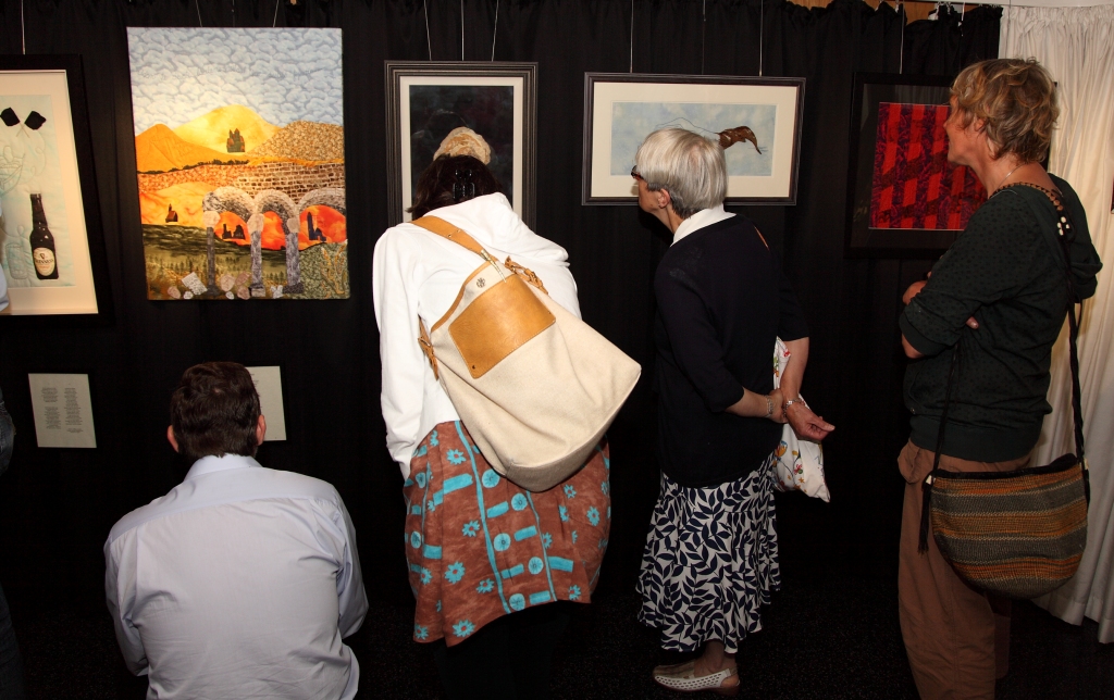 Intently viewing the exhibits at the launch of the exhibition: 'An Interpretation of Seamus Heaney's 